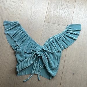 Crop top with ruffles and ribbon in the middle teal